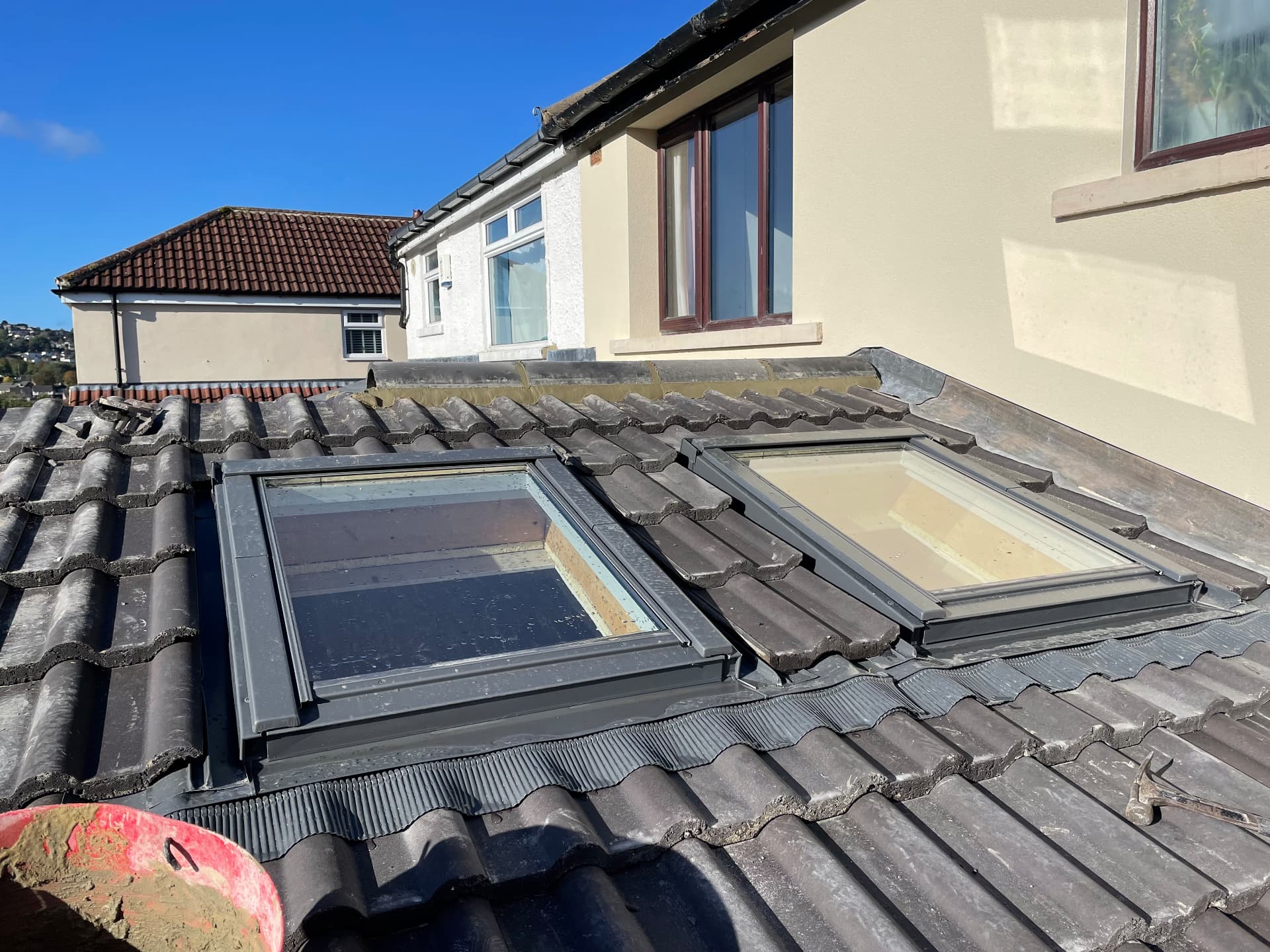 Two new skylight windows fitted into a tiled roof