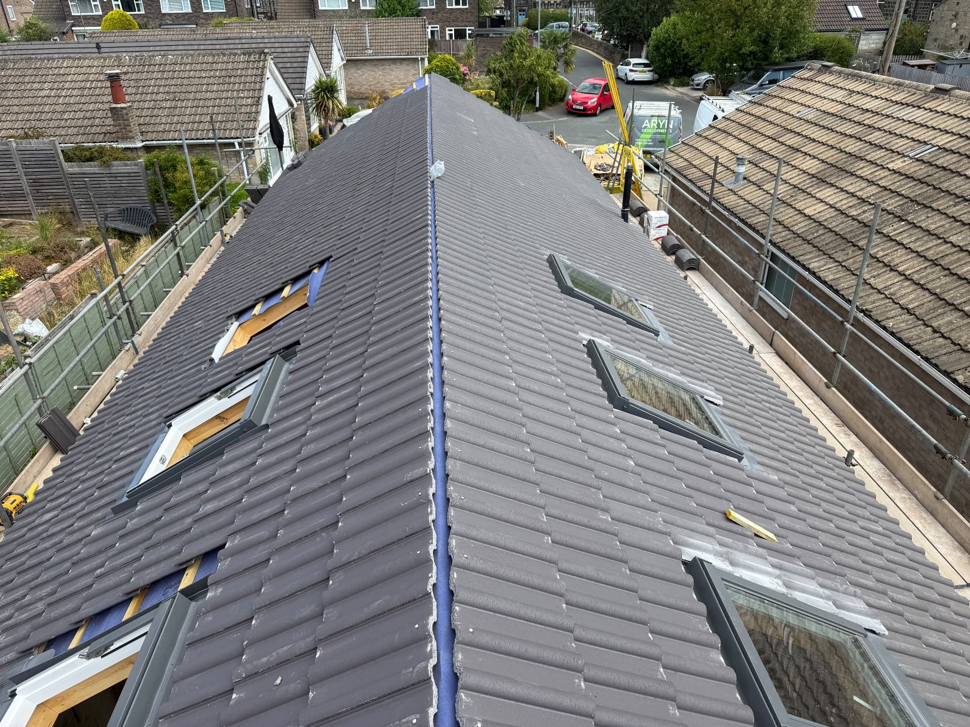 Loft conversion roof with multiple velux windows